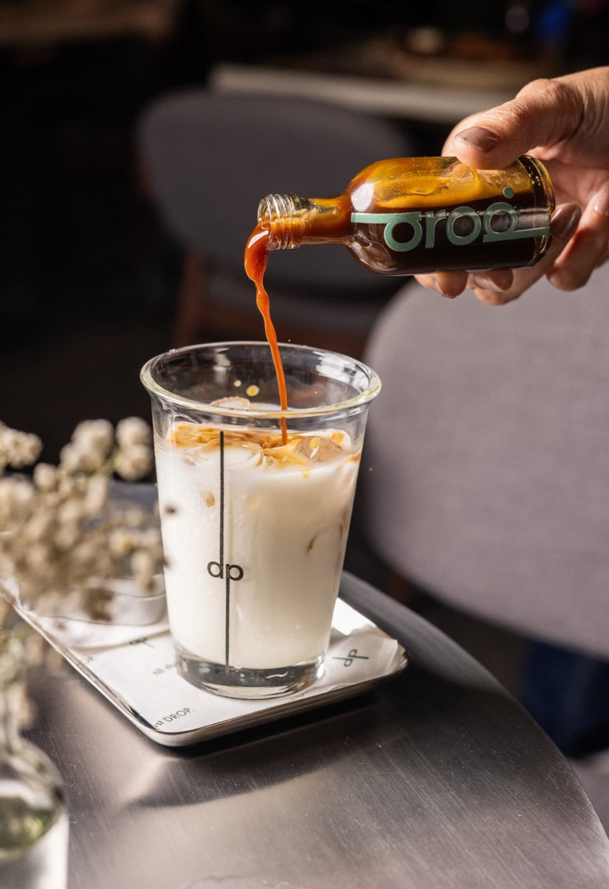 Espresso poured over iced milk