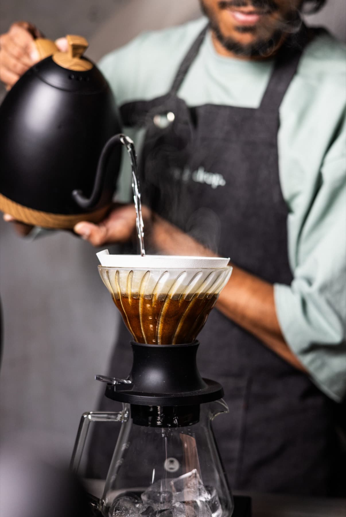A slow pour-over on a concrete counter