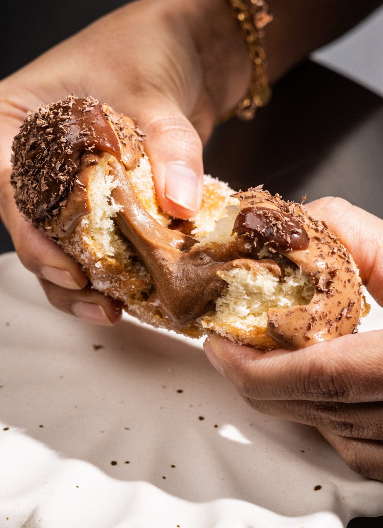 Filled doughnut pulled apart