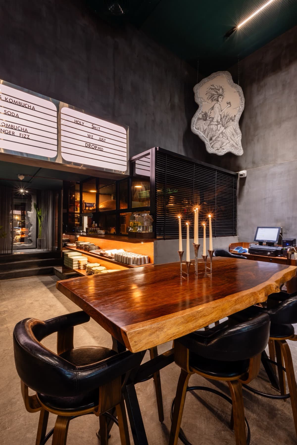Live-edge communal table in the industrial interior